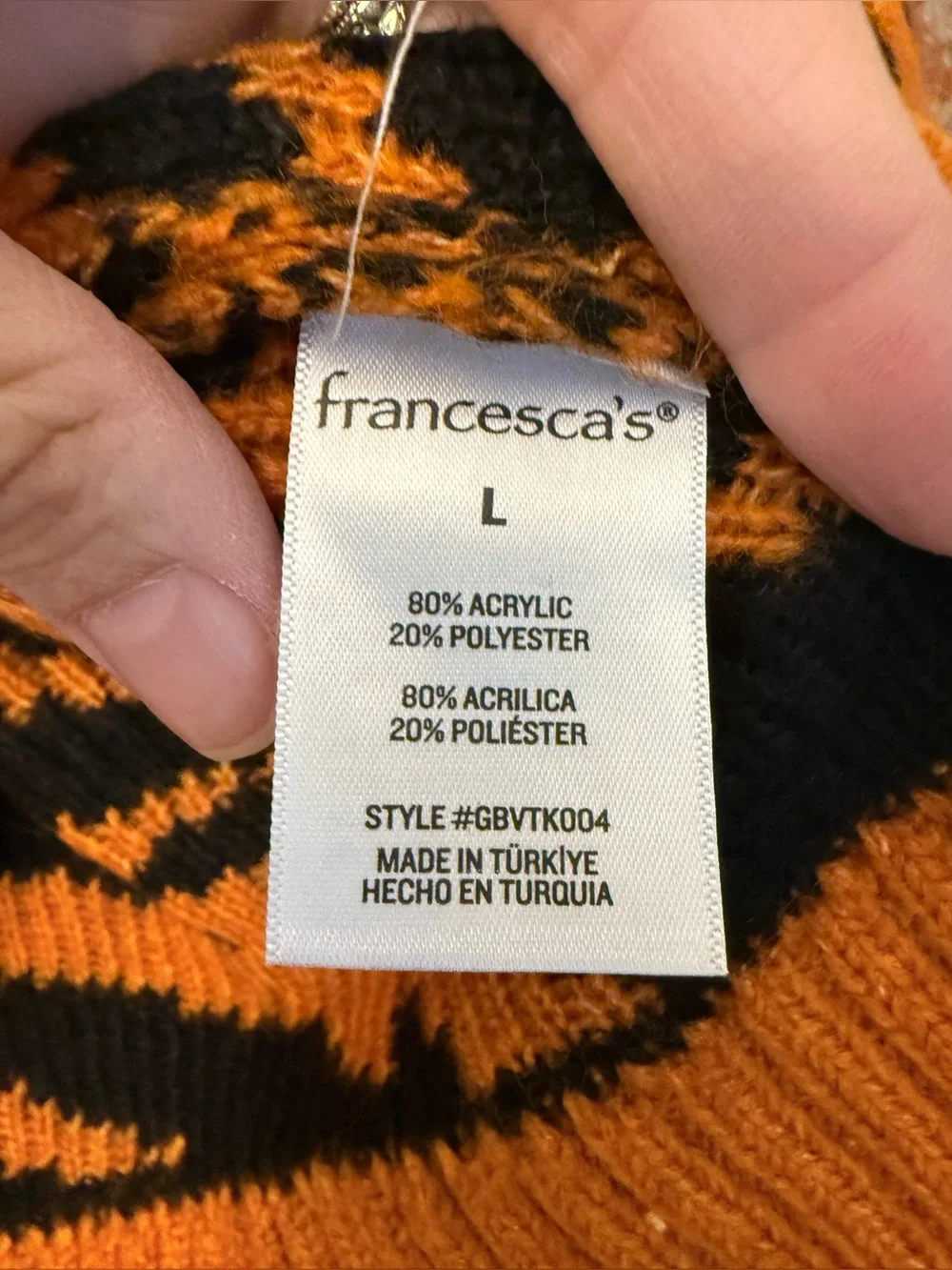 S46 - Francesca's Collections Orange and Black Animal-Print V-Neck Sweater